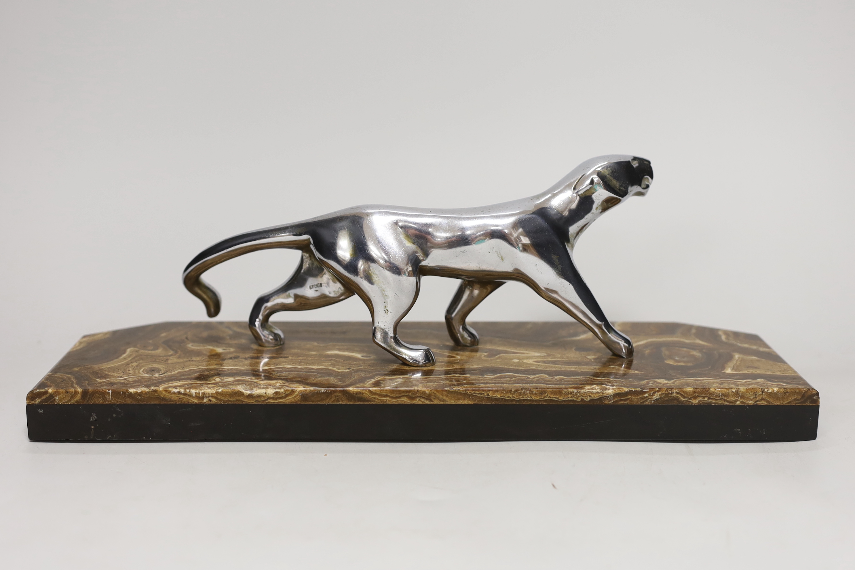 A French Art Deco silvered bronze ‘panther’ by Decoux, on marble base 38cm long